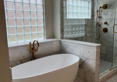 buffalo-home-remodeling-and-remediation-services-bathroom-remodel-freestanding-tub-glass-block-window