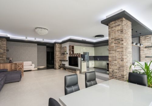 buffalo-home-remodeling-and-remediation-services-modern-open-concept-living-dining-room-stone-pillars